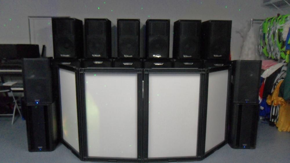 Full professional DJ booth and speaker setup